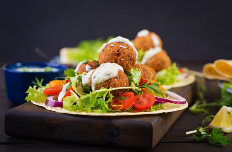 tortilla-wrap-with-falafel-fresh-salad-vegan-tacos-vegetarian-healthy-food_2829-6193